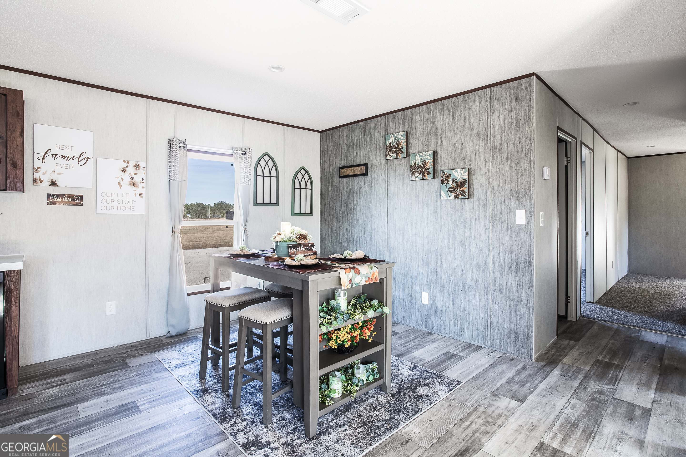 373 Barber Branch St. George, GA 31562 - Photo 10 of 30 a view of a workspace with furniture and wooden floor