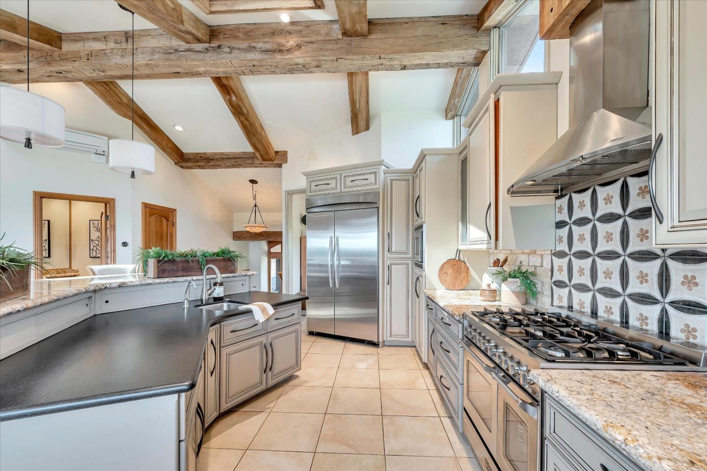 521 Amigo Road Soquel, CA 95073 - Photo 11 of 39 a kitchen with stainless steel appliances granite countertop a sink a stove and a refrigerator