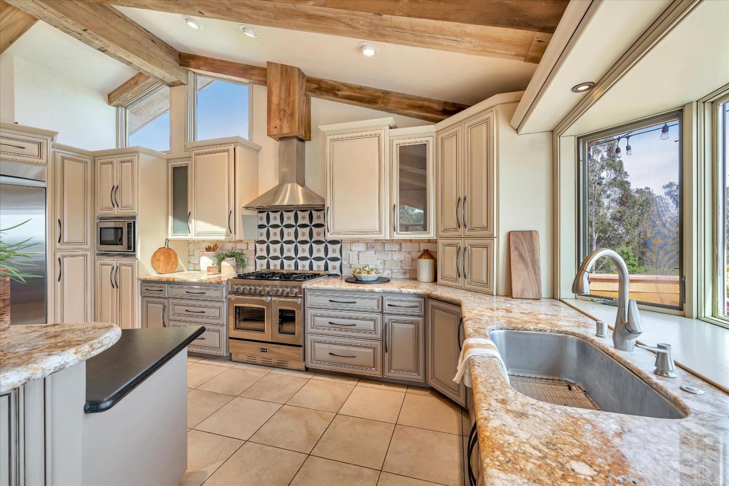 521 Amigo Road Soquel, CA 95073 - Photo 12 of 39 a kitchen with stainless steel appliances granite countertop a stove sink and cabinets