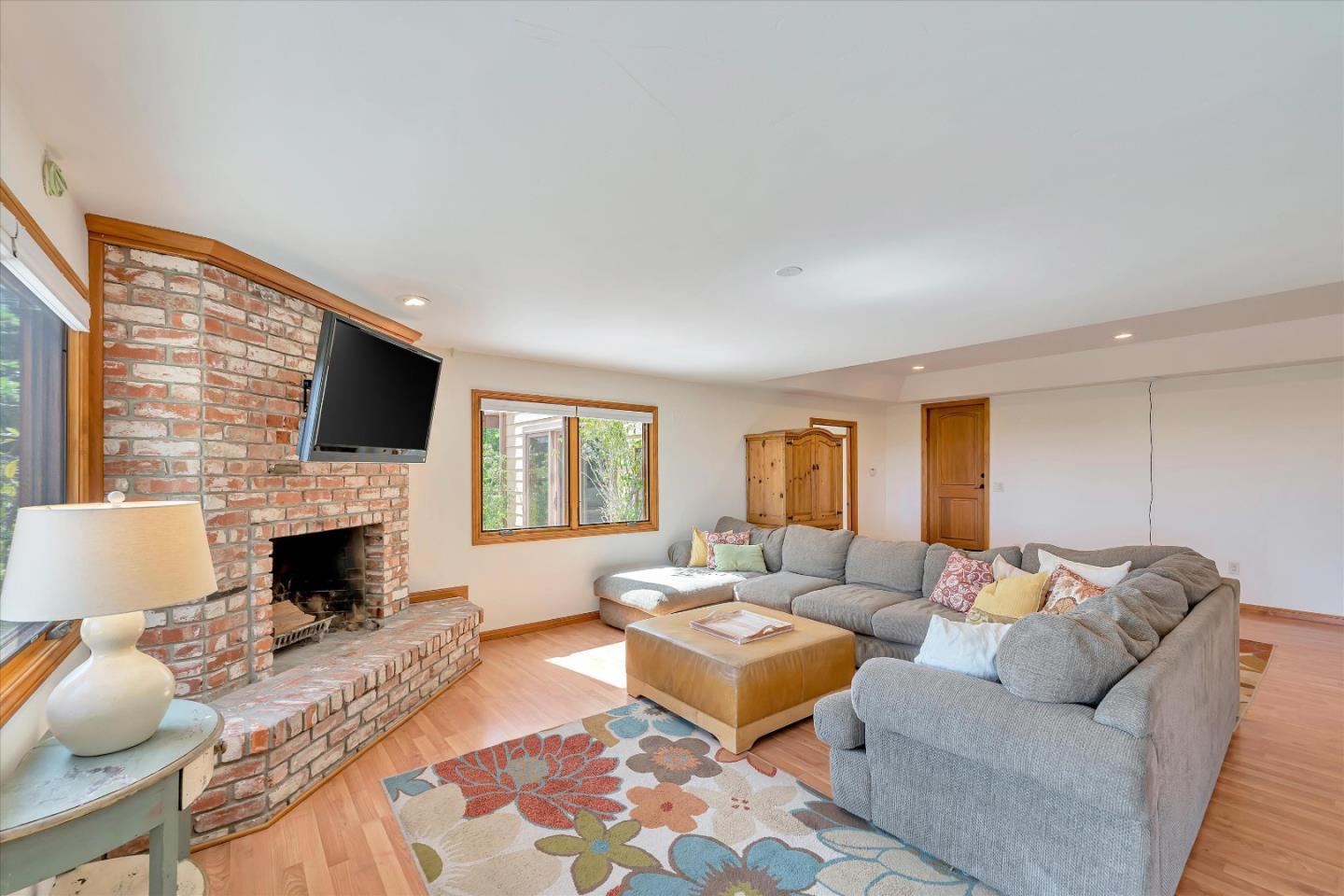 521 Amigo Road Soquel, CA 95073 - Photo 17 of 39 a living room with furniture fireplace and window