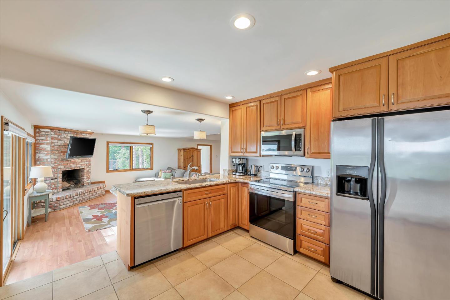 521 Amigo Road Soquel, CA 95073 - Photo 19 of 39 a kitchen with stainless steel appliances granite countertop a stove sink and cabinets