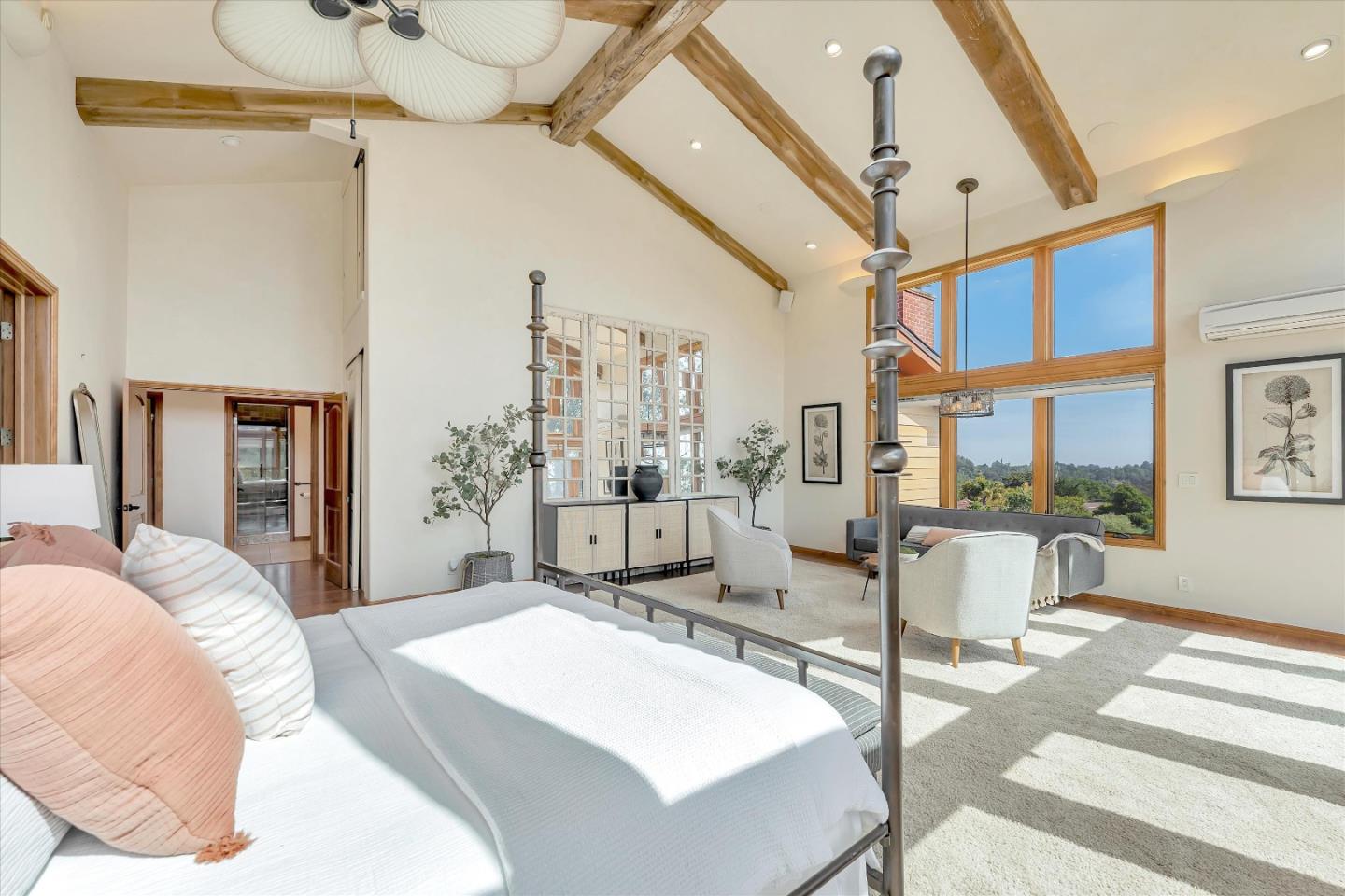521 Amigo Road Soquel, CA 95073 - Photo 25 of 39 a spacious bedroom with a bed a table and chair