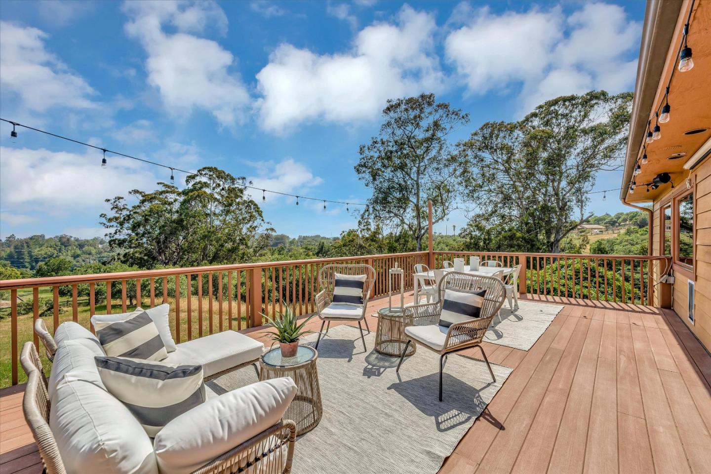 521 Amigo Road Soquel, CA 95073 - Photo 31 of 39 a balcony with wooden floor table and chairs