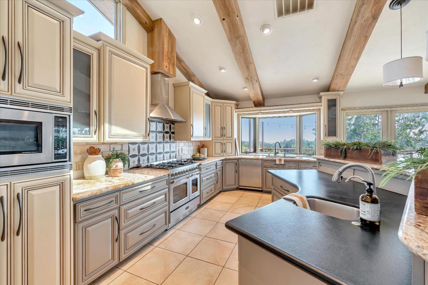 521 Amigo Road Soquel, CA 95073 - Photo 9 of 39 a kitchen with stainless steel appliances granite countertop sink stove and cabinets