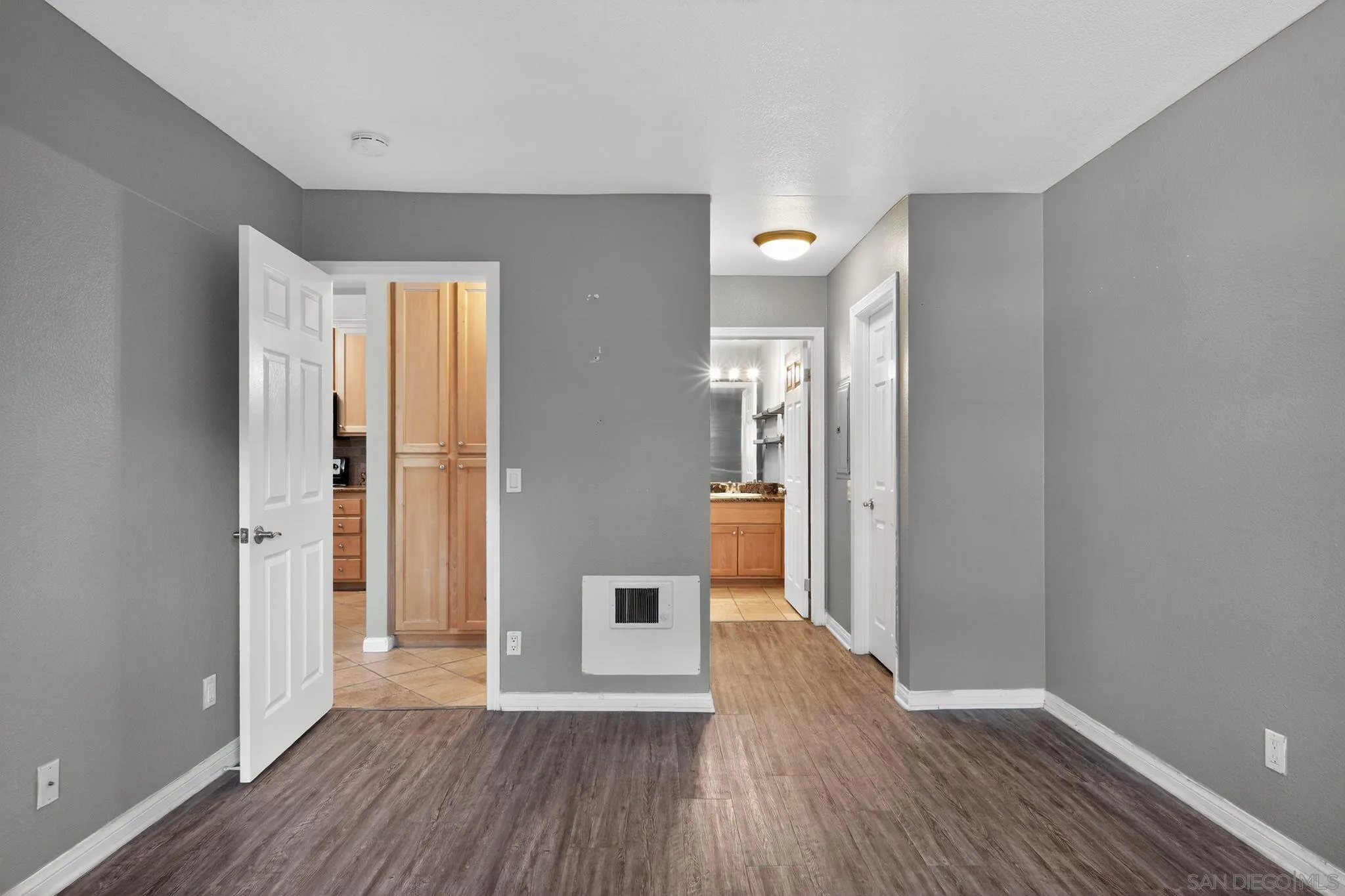 9860 Dale Avenue, Unit B9 Spring Valley, CA 91977 - Photo 18 of 31 a view of a hallway with wooden floor and a bathroom