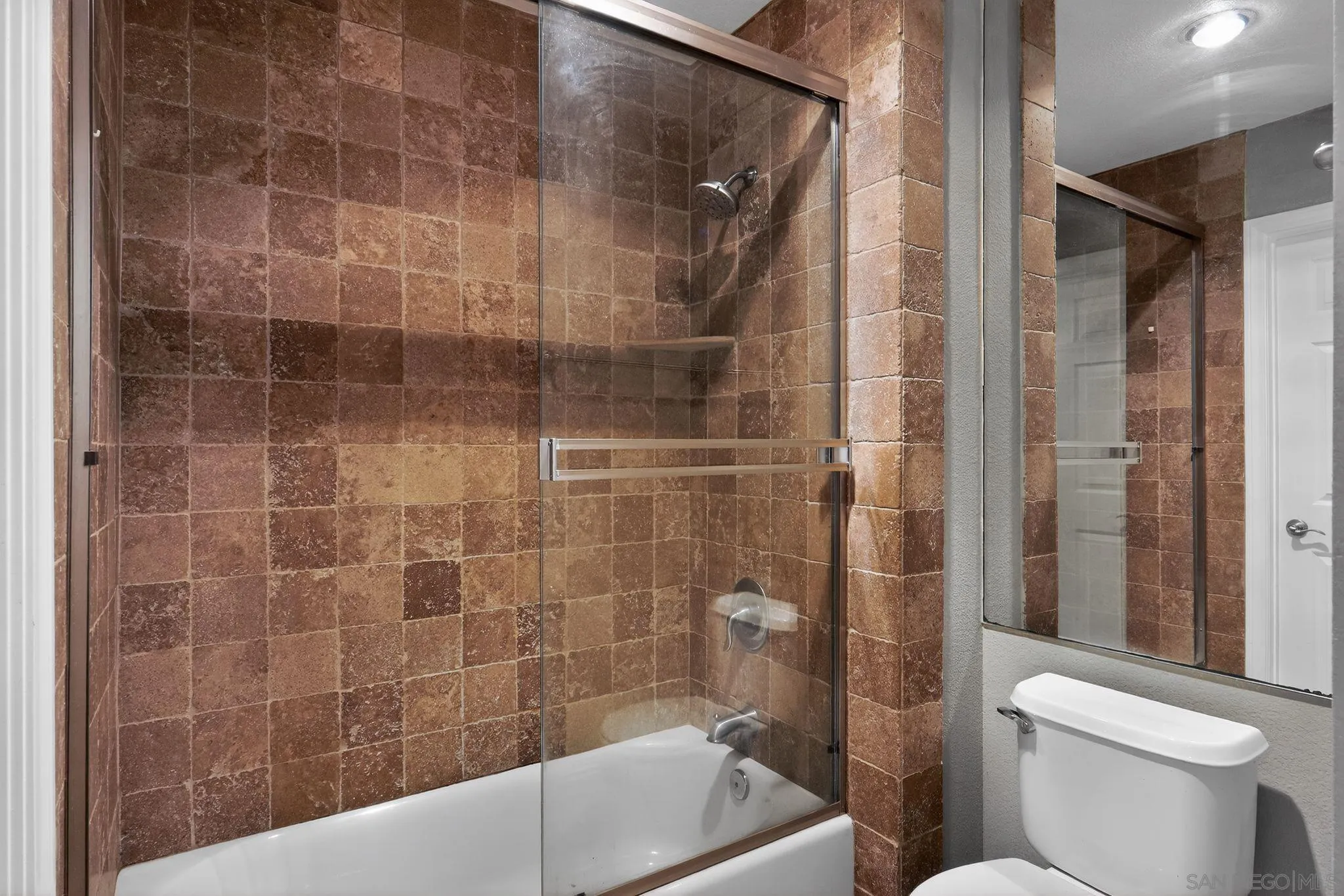 9860 Dale Avenue, Unit B9 Spring Valley, CA 91977 - Photo 21 of 31 a bathroom with a bathtub and a toilet