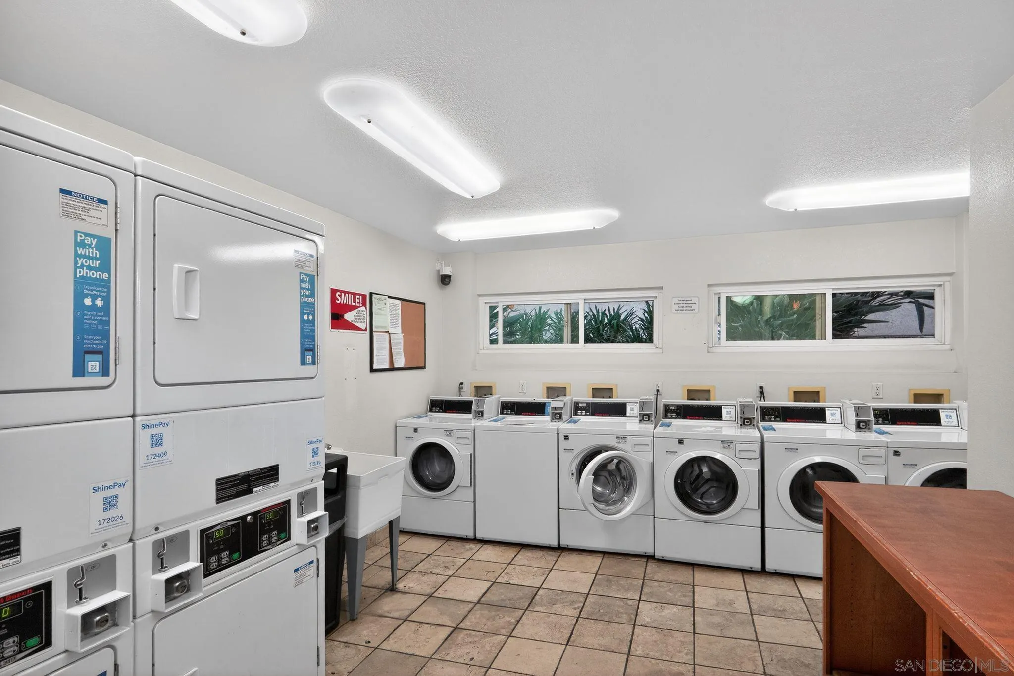 9860 Dale Avenue, Unit B9 Spring Valley, CA 91977 - Photo 24 of 31 a kitchen with a stove and a refrigerator