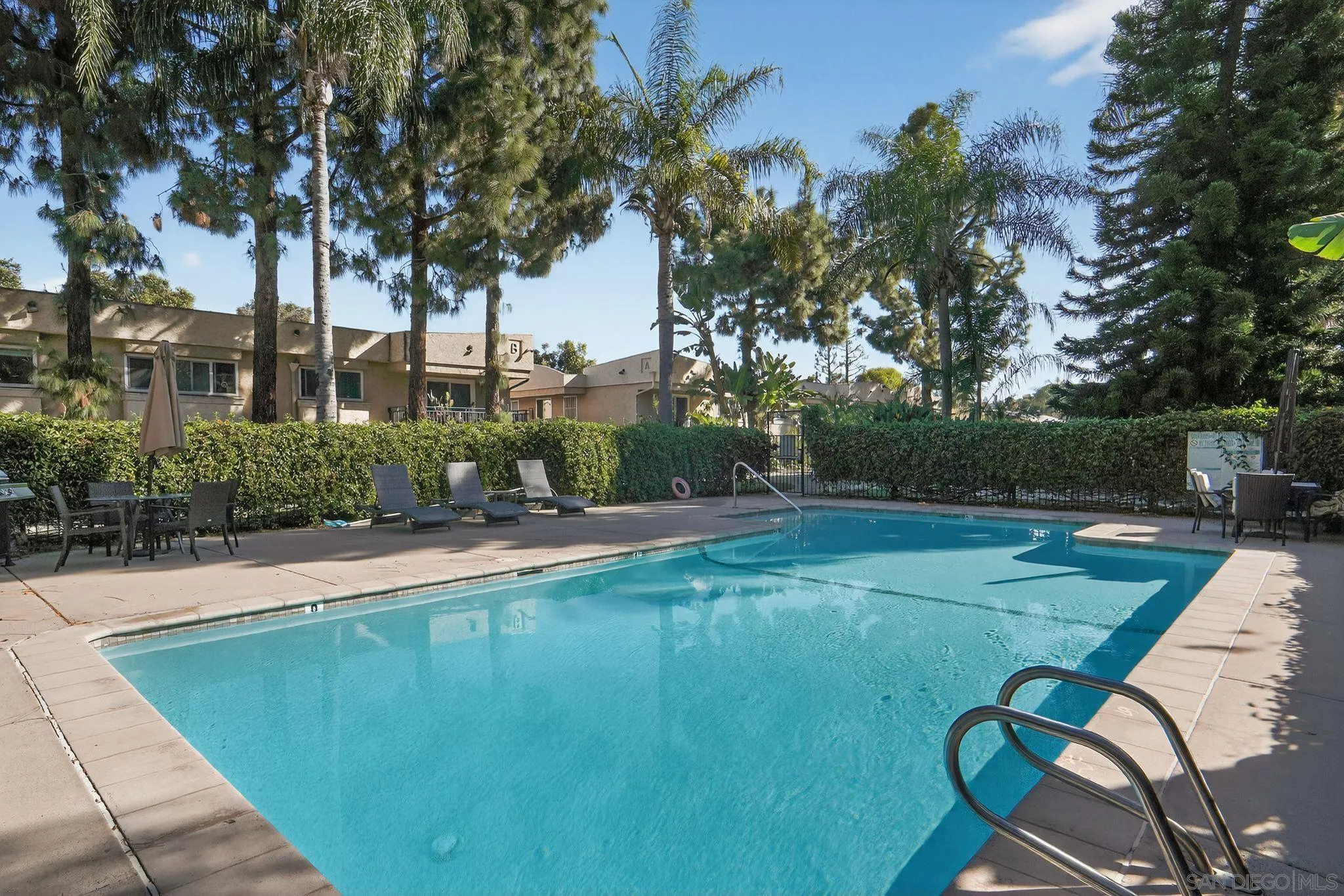 9860 Dale Avenue, Unit B9 Spring Valley, CA 91977 - Photo 25 of 31 a view of a swimming pool with a patio