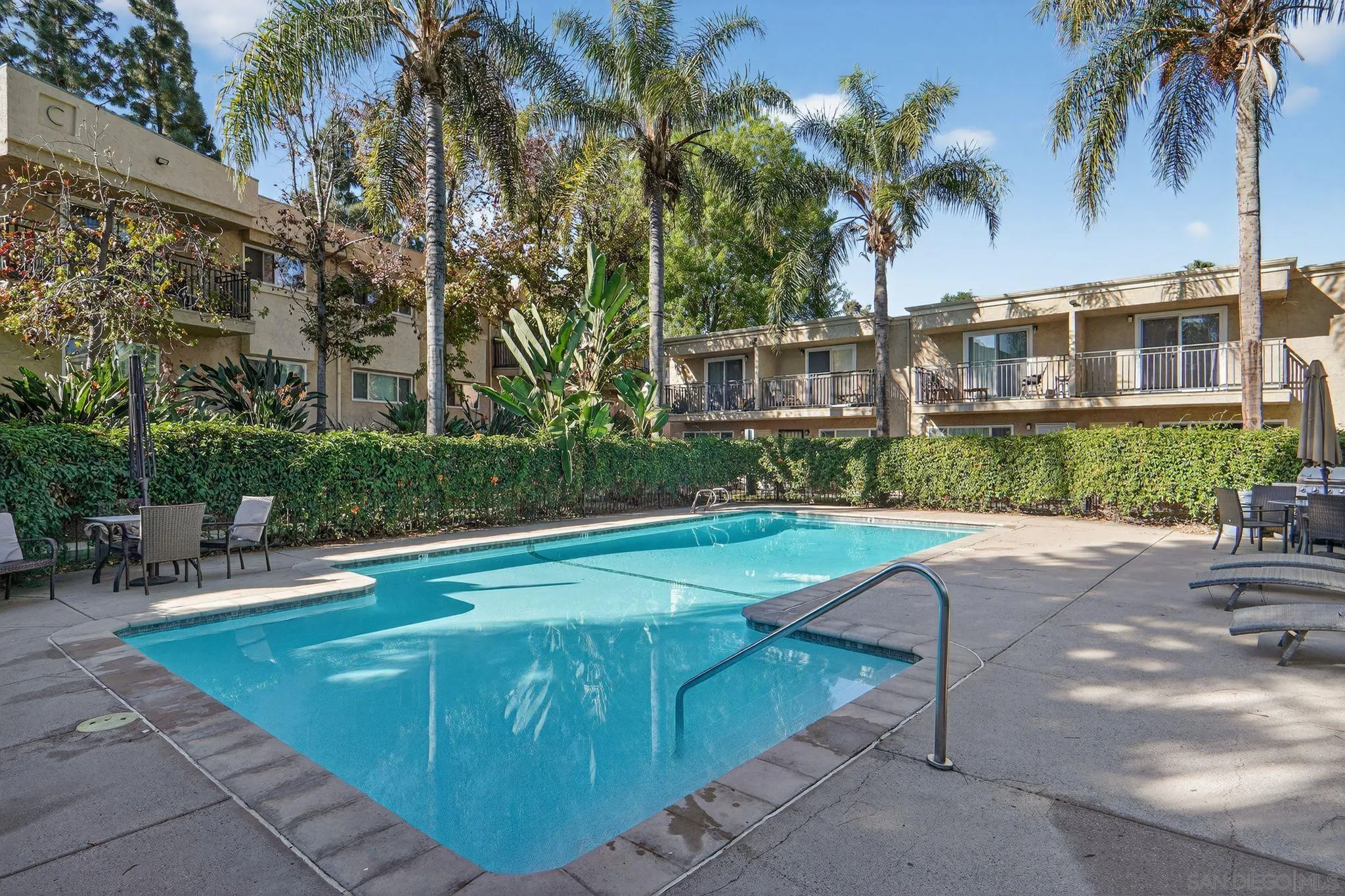 9860 Dale Avenue, Unit B9 Spring Valley, CA 91977 - Photo 26 of 31 a swimming pool with outdoor seating and yard