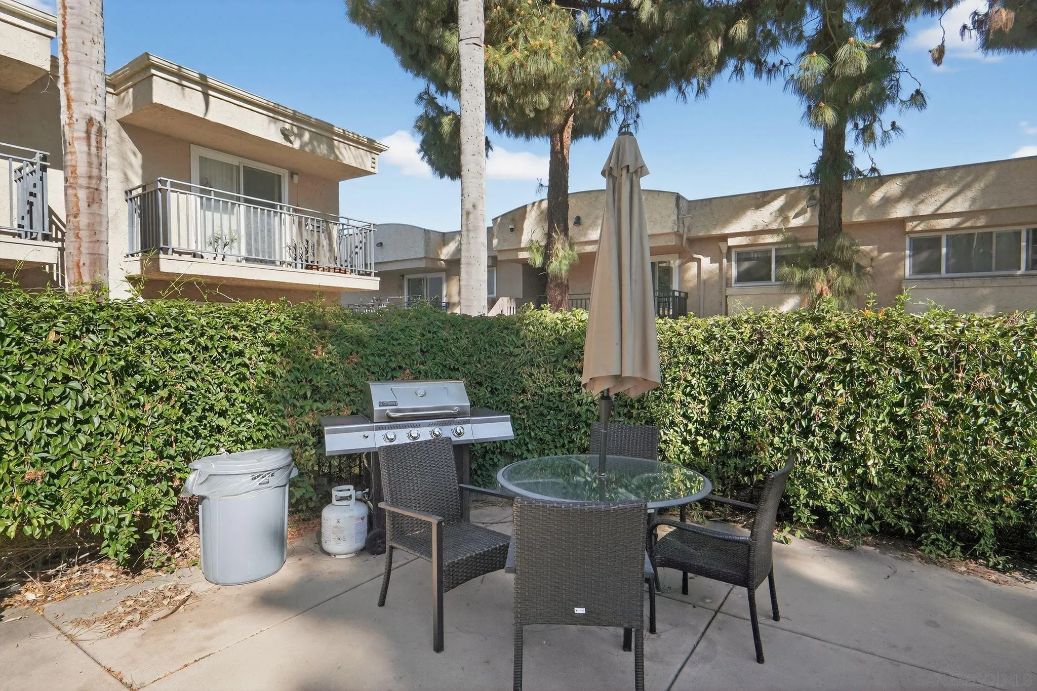 9860 Dale Avenue, Unit B9 Spring Valley, CA 91977 - Photo 29 of 31 a view of a patio filled with furniture and a garden