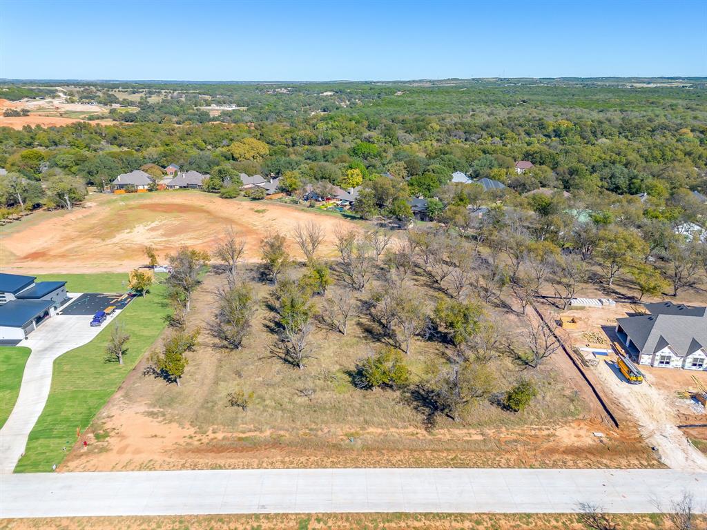 1148 West Landings Road North Granbury, TX 76049 - Photo 3 of 36 an aerial view of a houses with a yard