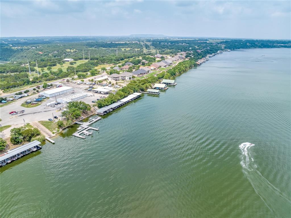 1148 West Landings Road North Granbury, TX 76049 - Photo 34 of 36 an aerial view of ocean and residential houses with outdoor space