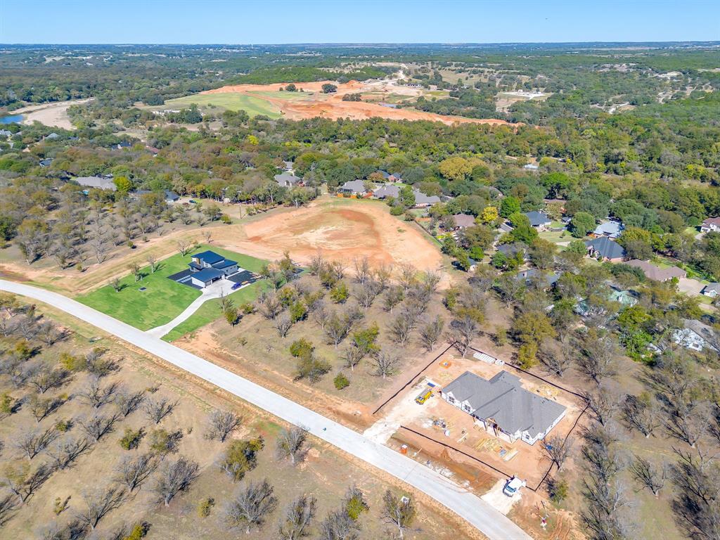 1148 West Landings Road North Granbury, TX 76049 - Photo 4 of 36 a view of a city from a yard