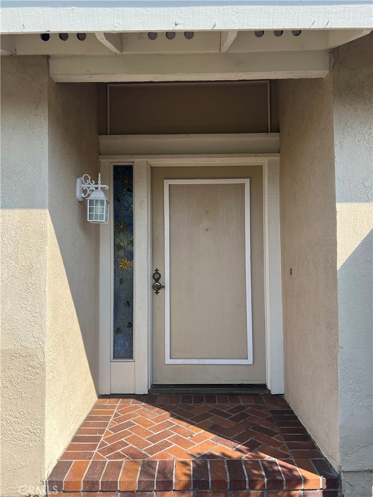 a view of a livingroom with wooden floor and staircase