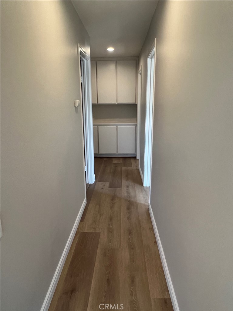 26 Alderbrook Irvine, CA 92604 - Photo 8 of 16 a view of a hallway with wooden floor