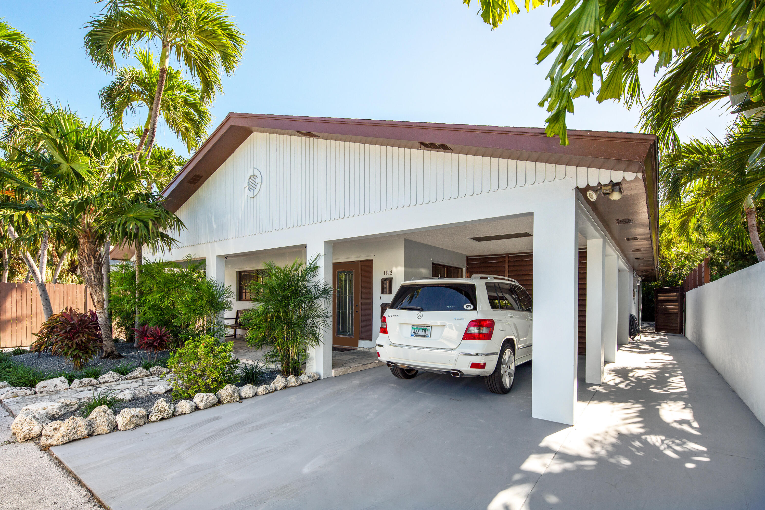 1612 Washington Street Key West, FL 33040 - Photo 1 of 38 a view of a car park in front of house