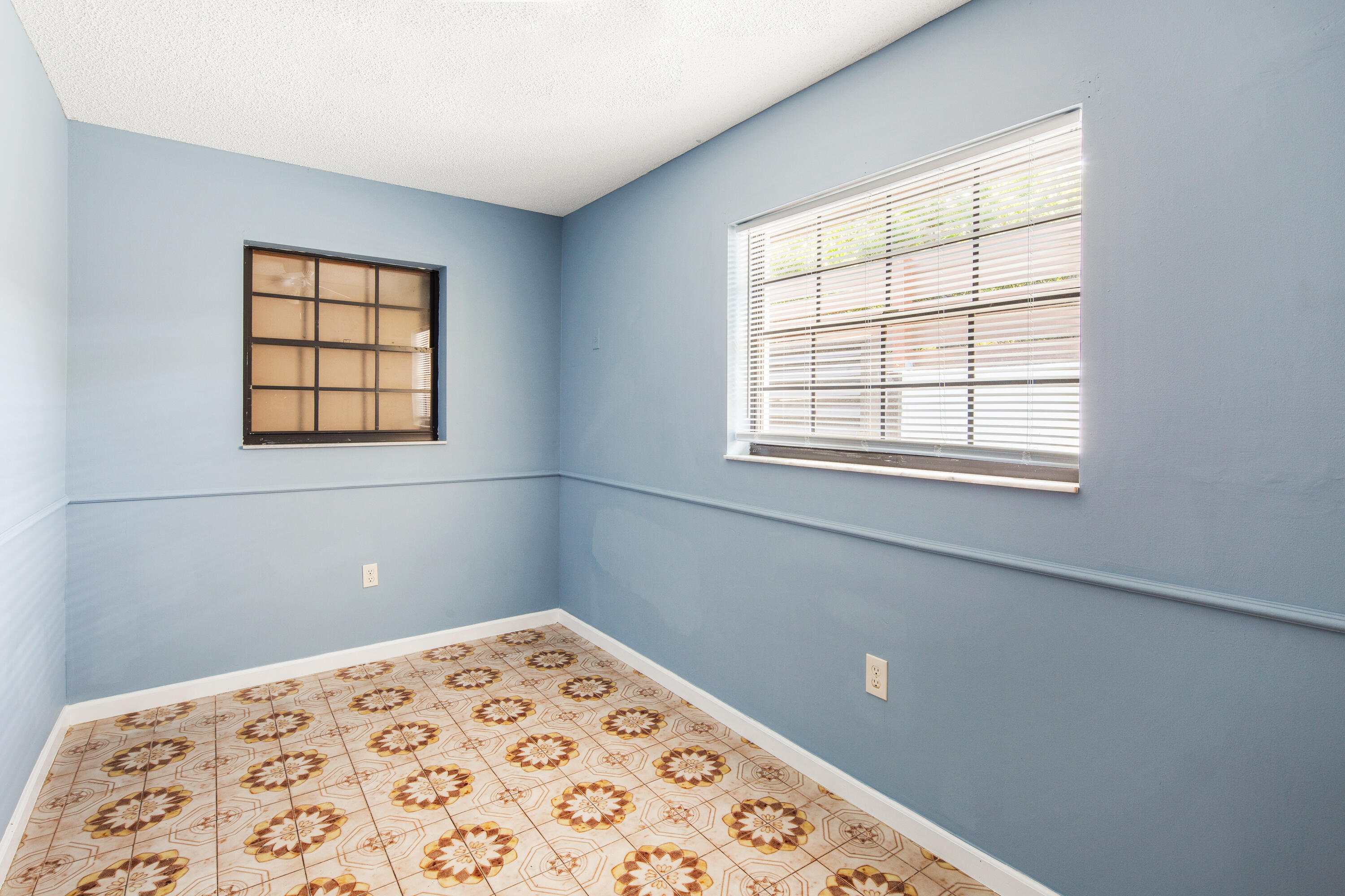 1612 Washington Street Key West, FL 33040 - Photo 15 of 38 a view of a bedroom with a window