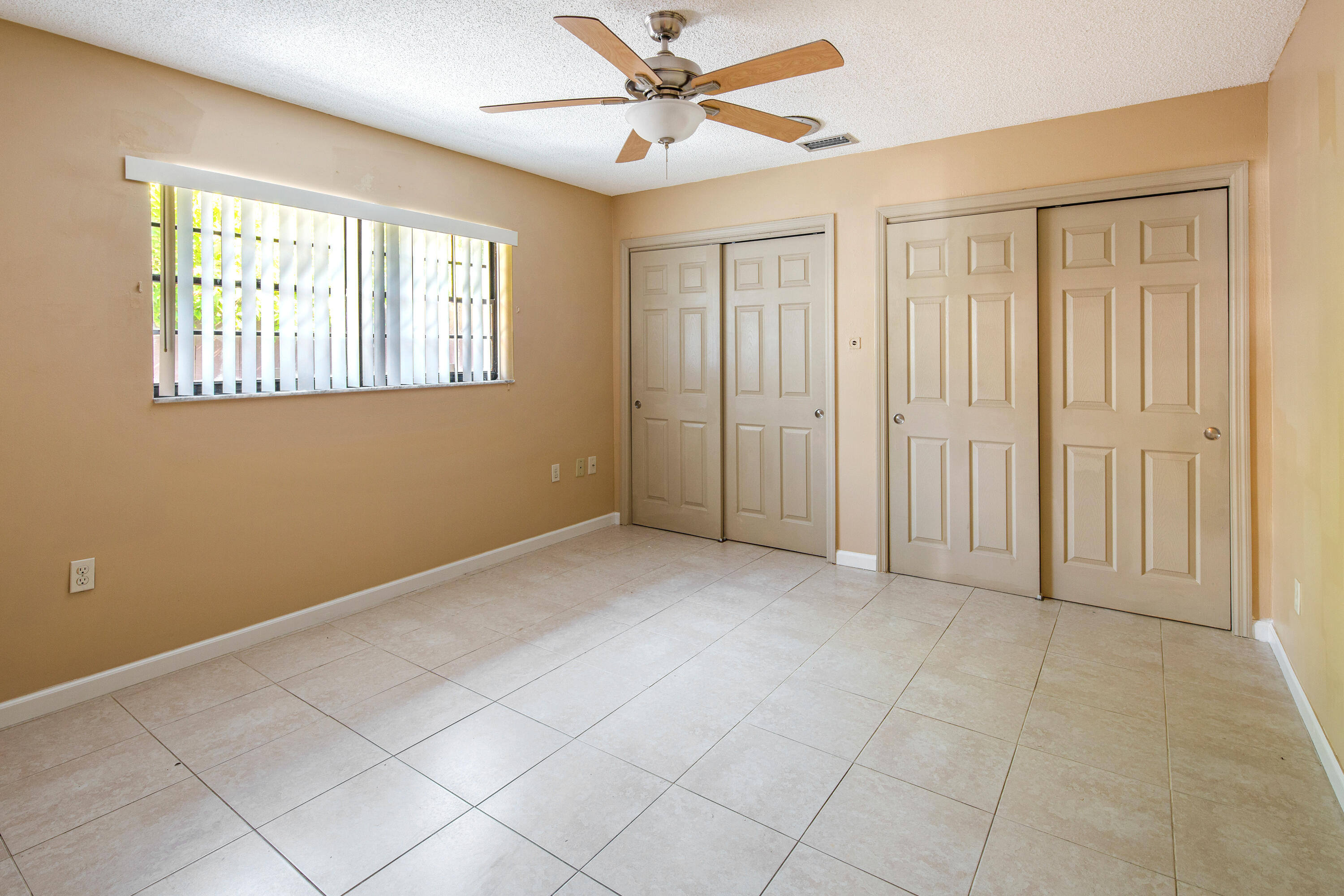1612 Washington Street Key West, FL 33040 - Photo 17 of 38 an empty room with windows and fan
