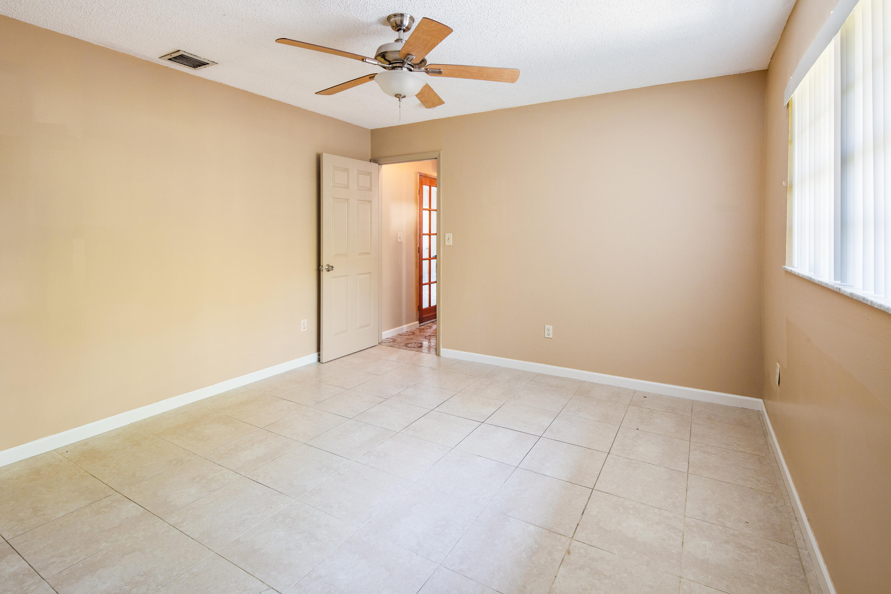 1612 Washington Street Key West, FL 33040 - Photo 18 of 38 an empty room with windows and fan