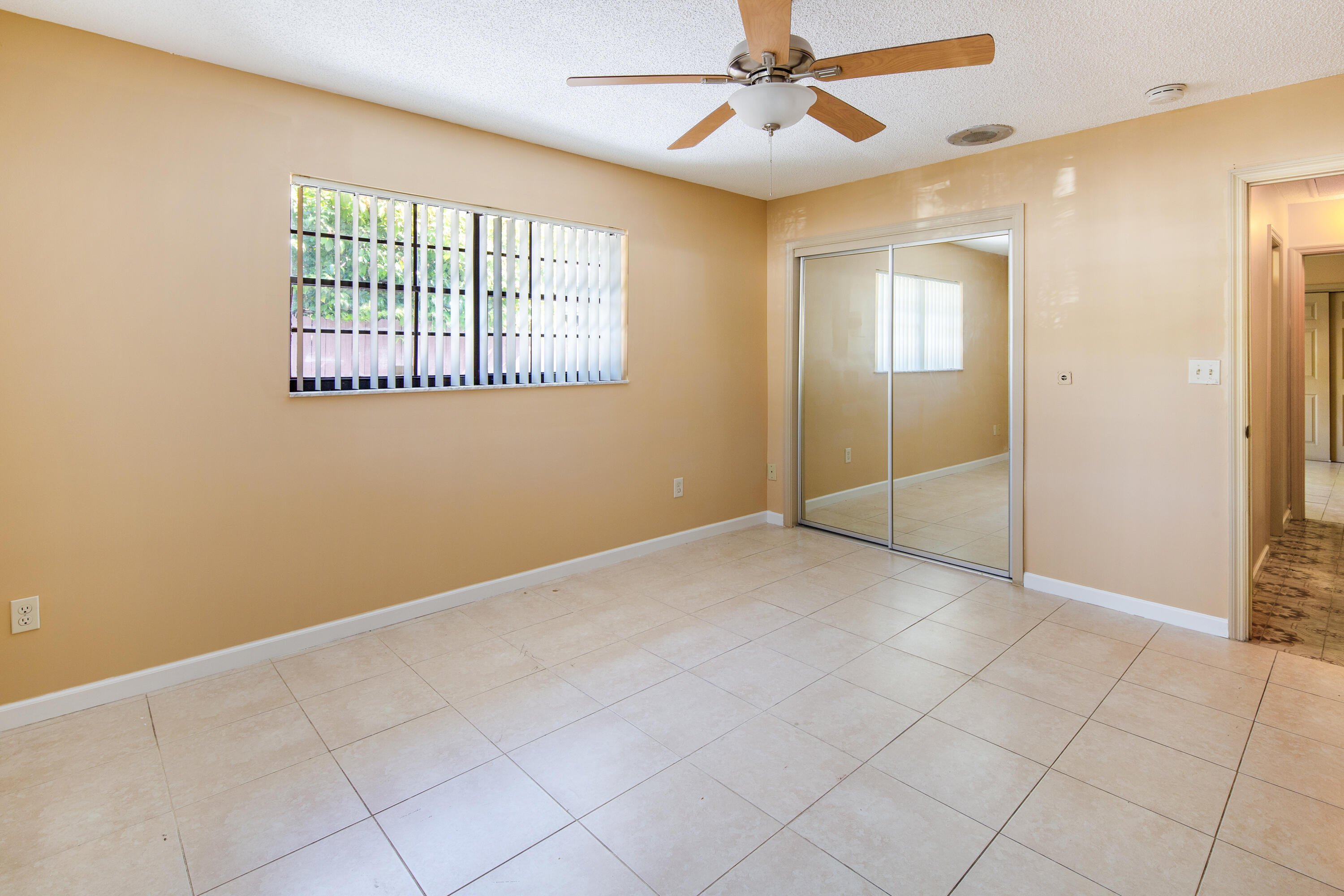 1612 Washington Street Key West, FL 33040 - Photo 22 of 38 an empty room with windows and fan