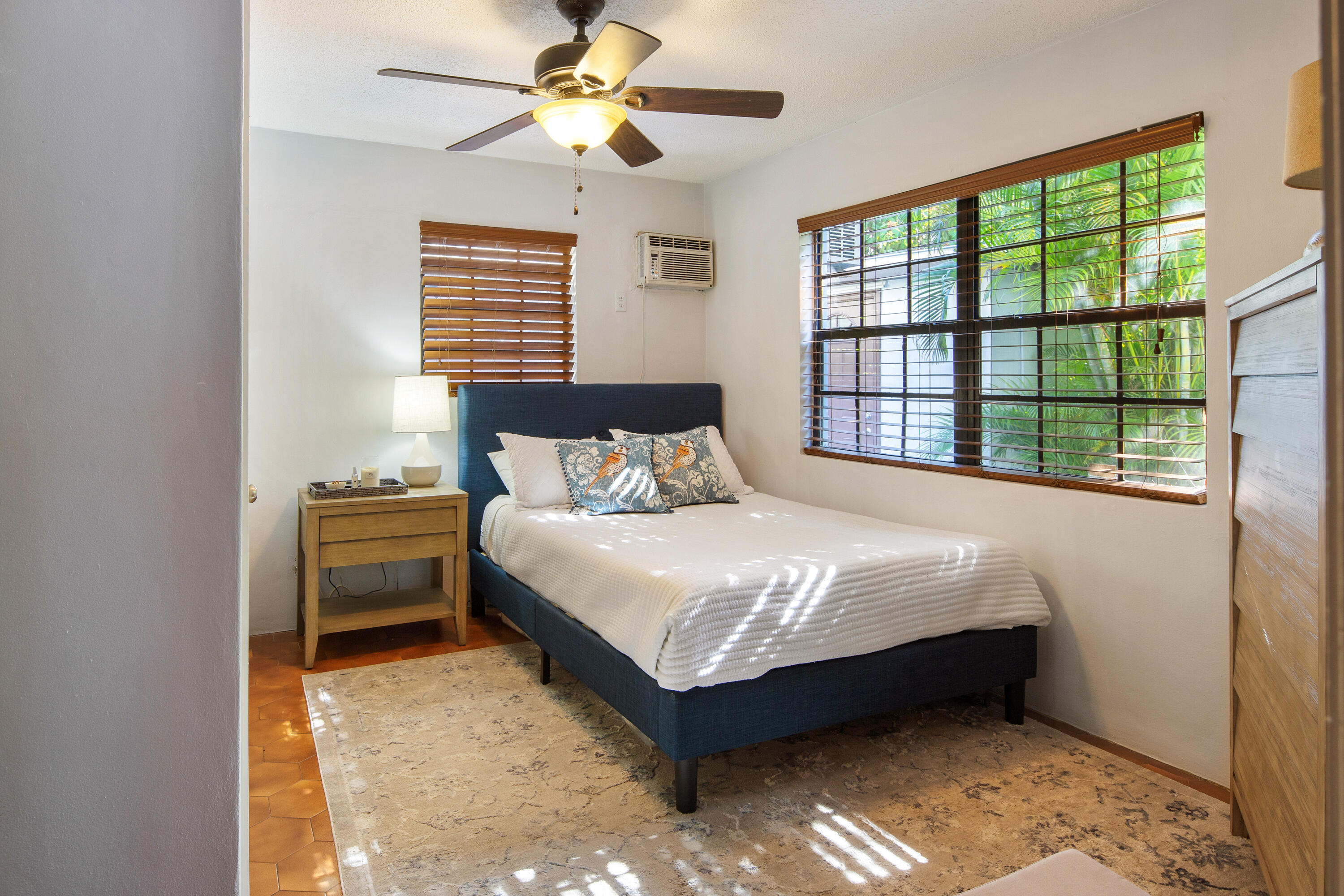 1612 Washington Street Key West, FL 33040 - Photo 30 of 38 a bedroom with a bed and a window