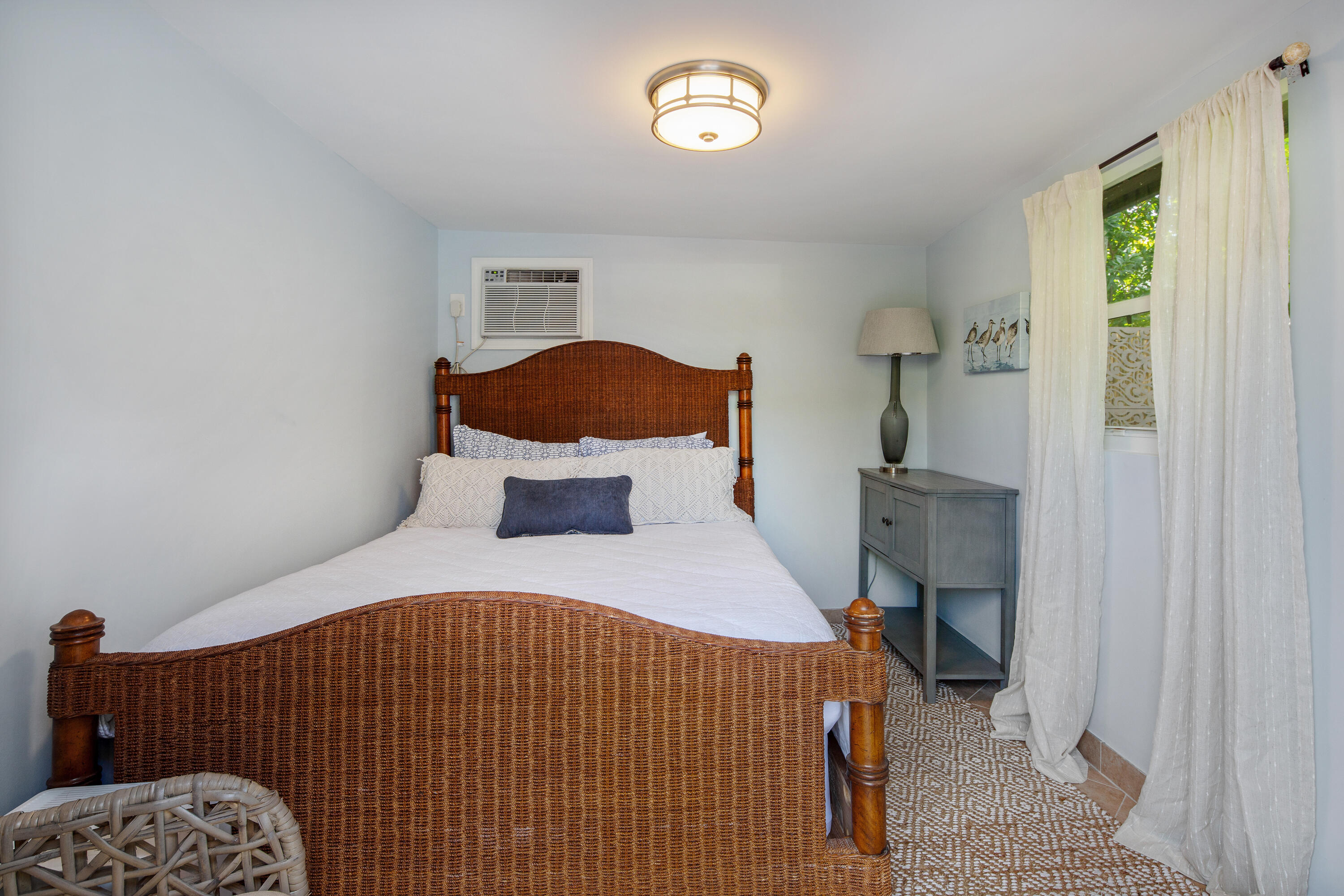 1612 Washington Street Key West, FL 33040 - Photo 38 of 38 a bedroom with a bed and a window