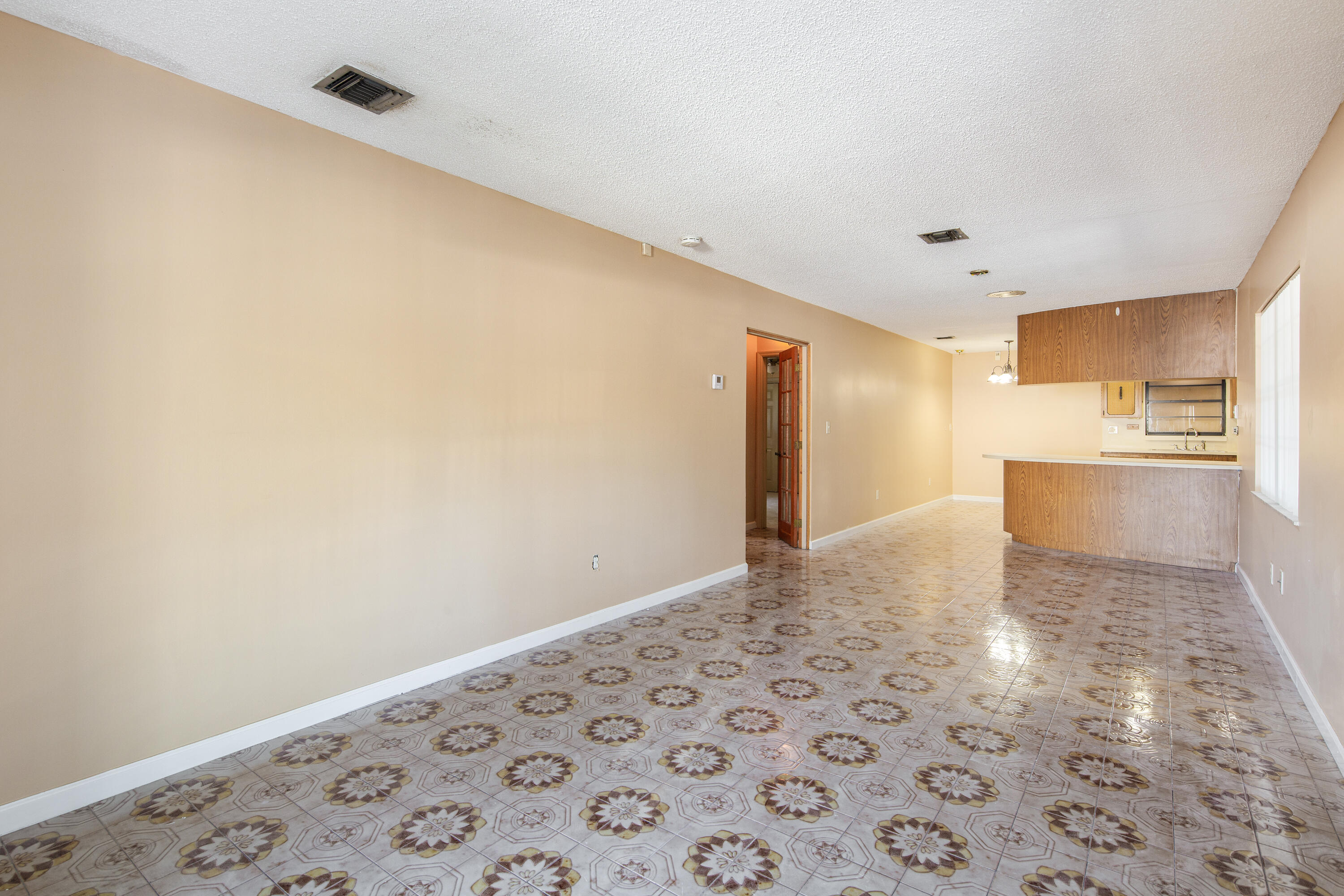 1612 Washington Street Key West, FL 33040 - Photo 8 of 38 a view of a big room with wooden cabinet and a rug