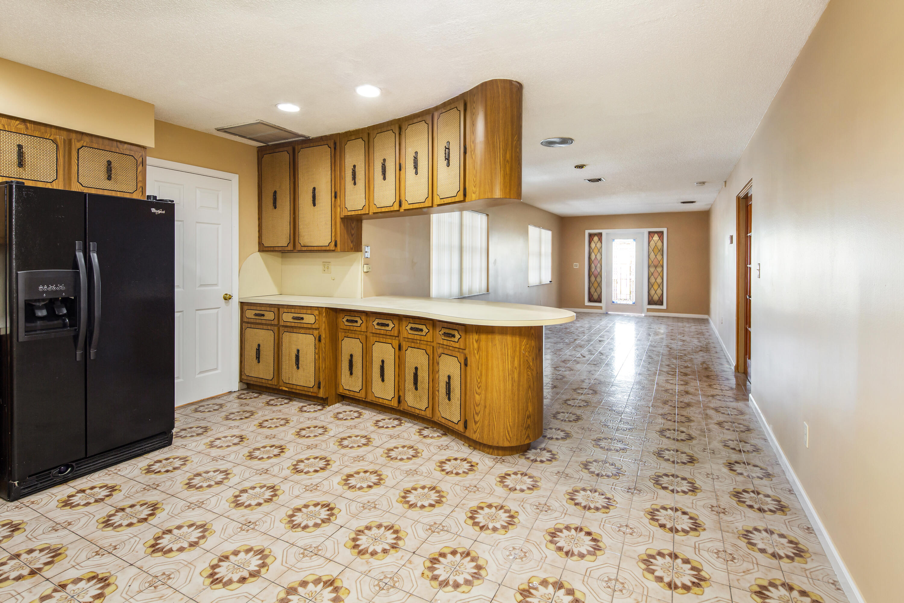 1612 Washington Street Key West, FL 33040 - Photo 10 of 38 a kitchen with stainless steel appliances a refrigerator and cabinets