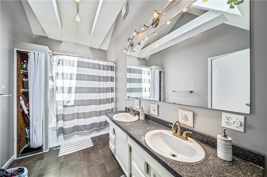 3211 River Road Perry, OH 44081 - Photo 17 of 34 Bathroom featuring tile floors, oversized vanity, and double sink