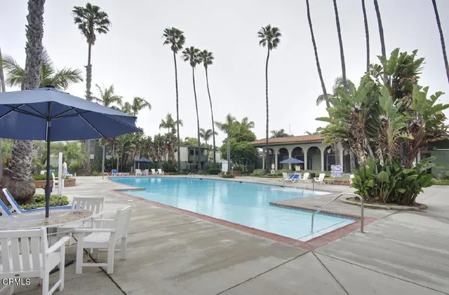 a view of a swimming pool with chairs