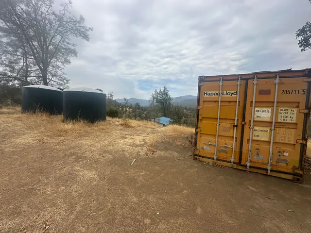 a view of a backyard of the house