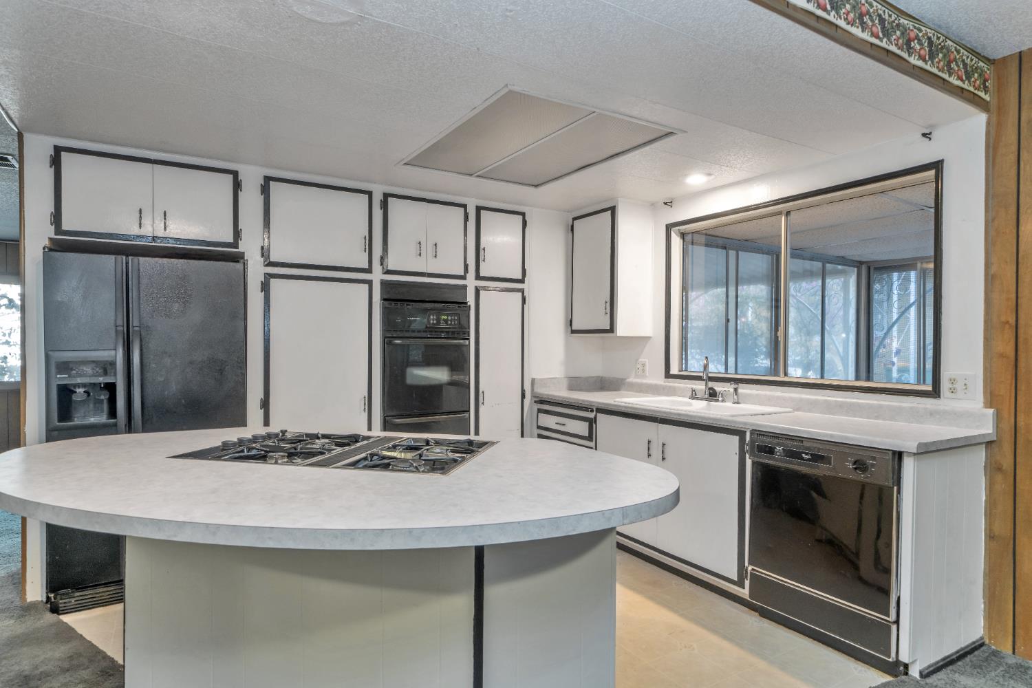 3550 China Garden Road, Unit 38 Placerville, CA 95667 - Photo 2 of 18 a kitchen with stainless steel appliances granite countertop a sink and a stove