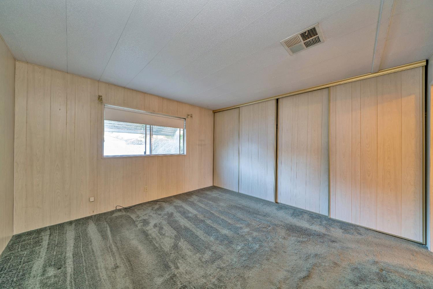 3550 China Garden Road, Unit 38 Placerville, CA 95667 - Photo 8 of 18 an empty room with a empty space and windows