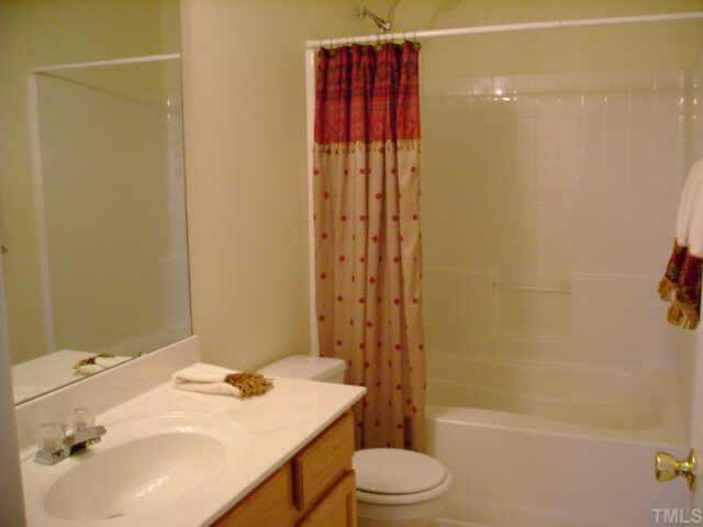 8128 Tara Ridge Road Raleigh, NC 27616 - Photo 4 of 10 a bathroom with a sink toilet and shower