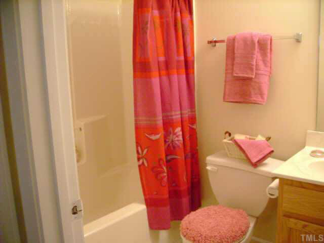 8128 Tara Ridge Road Raleigh, NC 27616 - Photo 7 of 10 a bathroom with a sink and toilet
