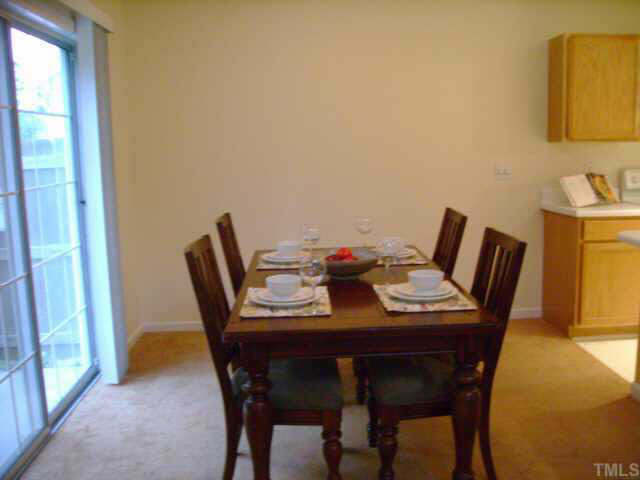 8128 Tara Ridge Road Raleigh, NC 27616 - Photo 9 of 10 a dining room with furniture and window