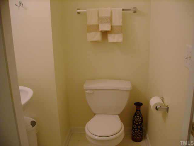 8128 Tara Ridge Road Raleigh, NC 27616 - Photo 10 of 10 a white toilet sitting next to a bathroom sink