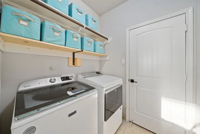 a utility room with dryer and washer