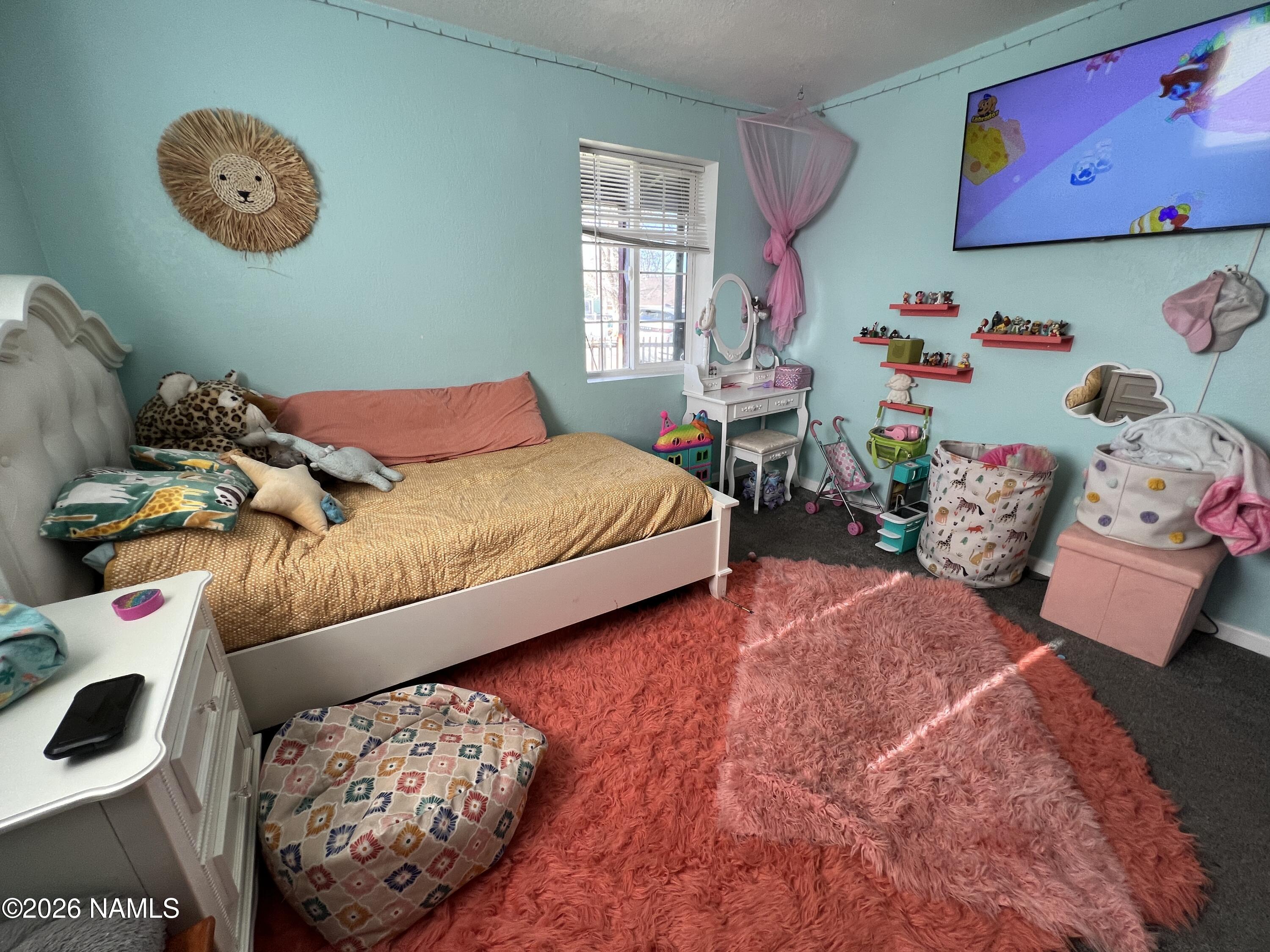 407 South 4th Street Williams, AZ 86046 - Photo 11 of 25 a bedroom with a bed and a window