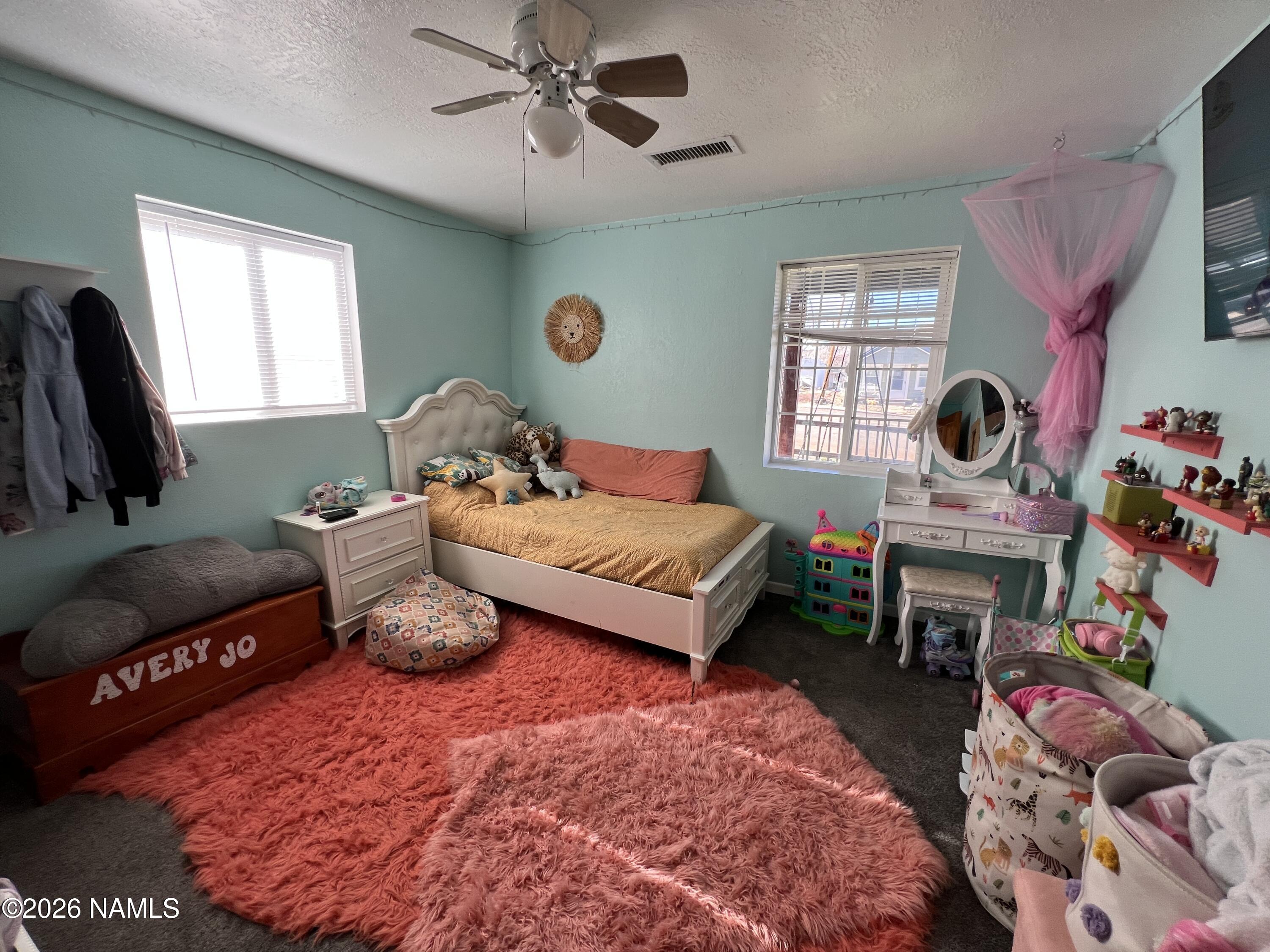 407 South 4th Street Williams, AZ 86046 - Photo 12 of 25 a bedroom with a bed dresser and a window