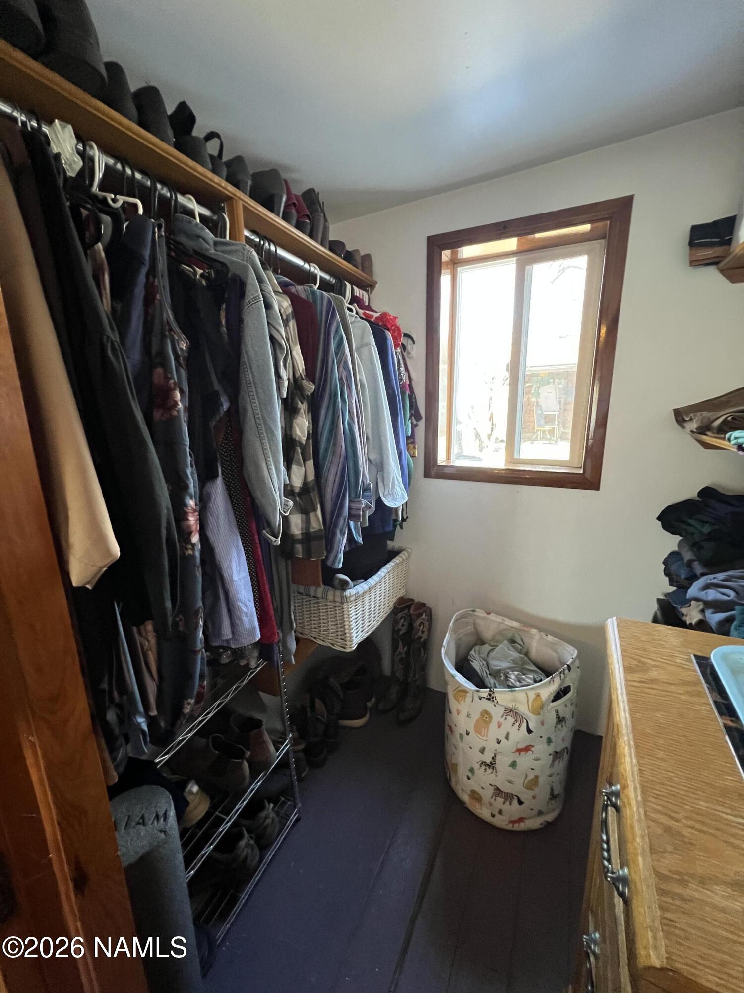 407 South 4th Street Williams, AZ 86046 - Photo 16 of 25 a view of walk in closet with clothes and shoes