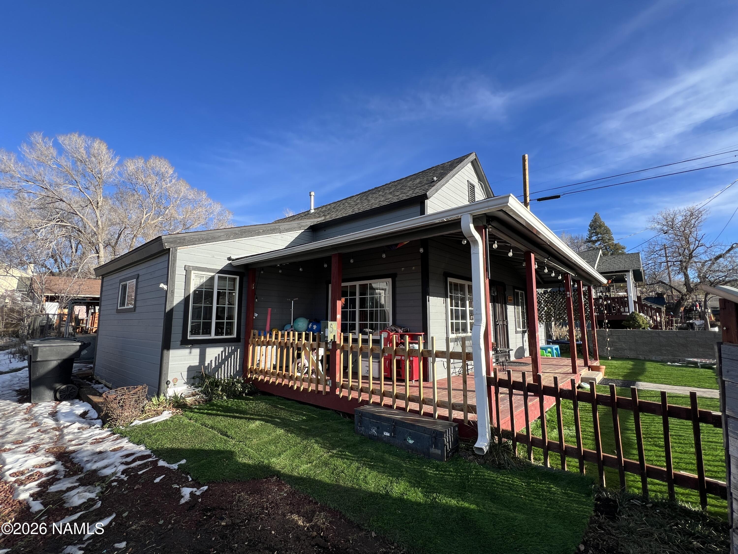 407 South 4th Street Williams, AZ 86046 - Photo 2 of 25 a view of a house with a yard and a garden