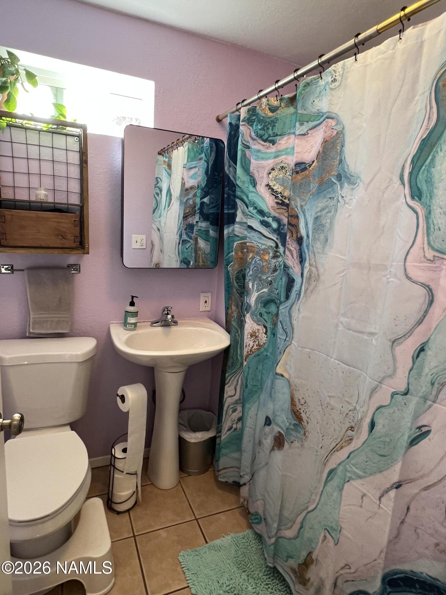 407 South 4th Street Williams, AZ 86046 - Photo 21 of 25 a bathroom with a sink toilet and shower