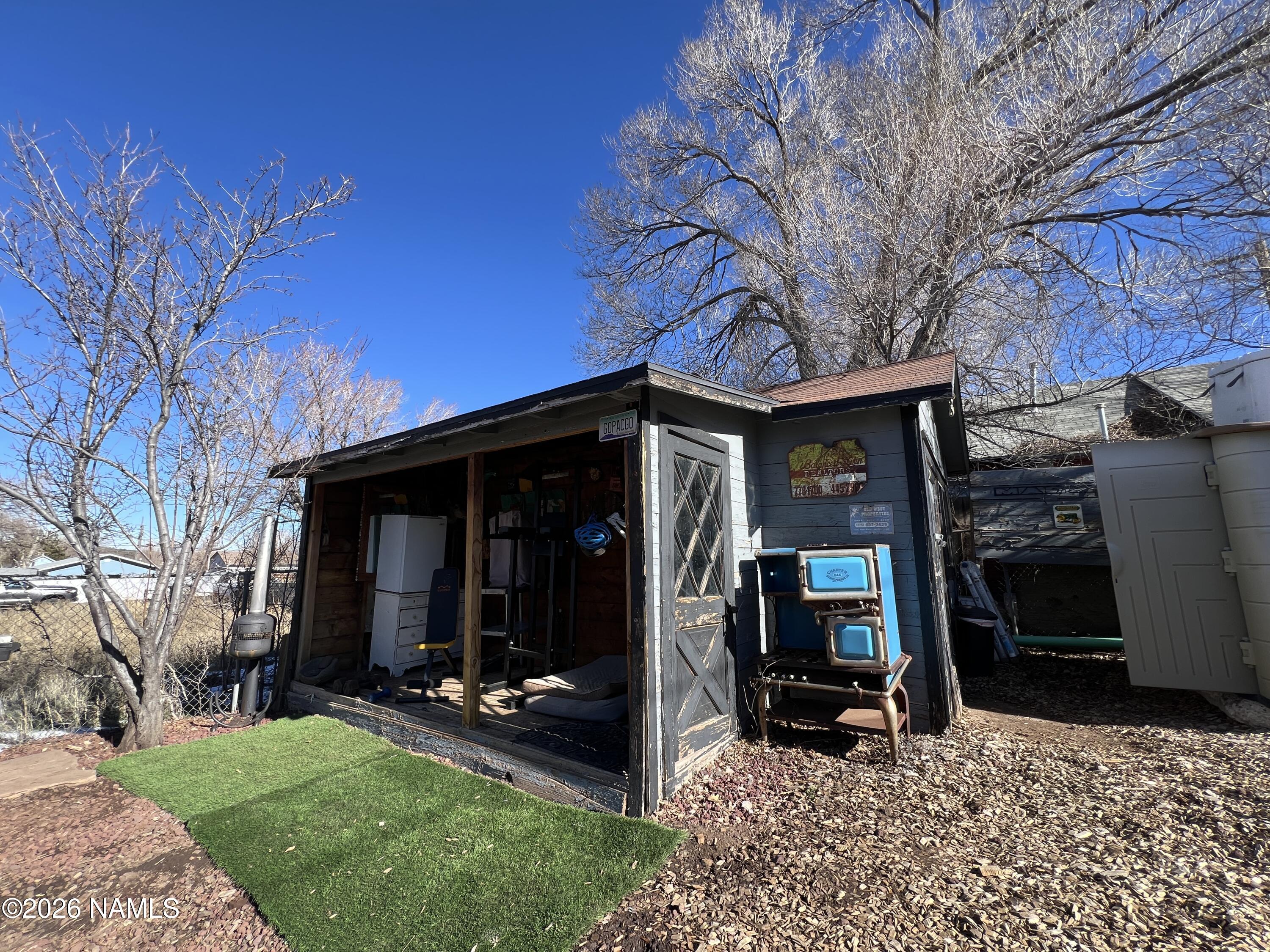 407 South 4th Street Williams, AZ 86046 - Photo 22 of 25 a view of a chair and table in backyard of the house