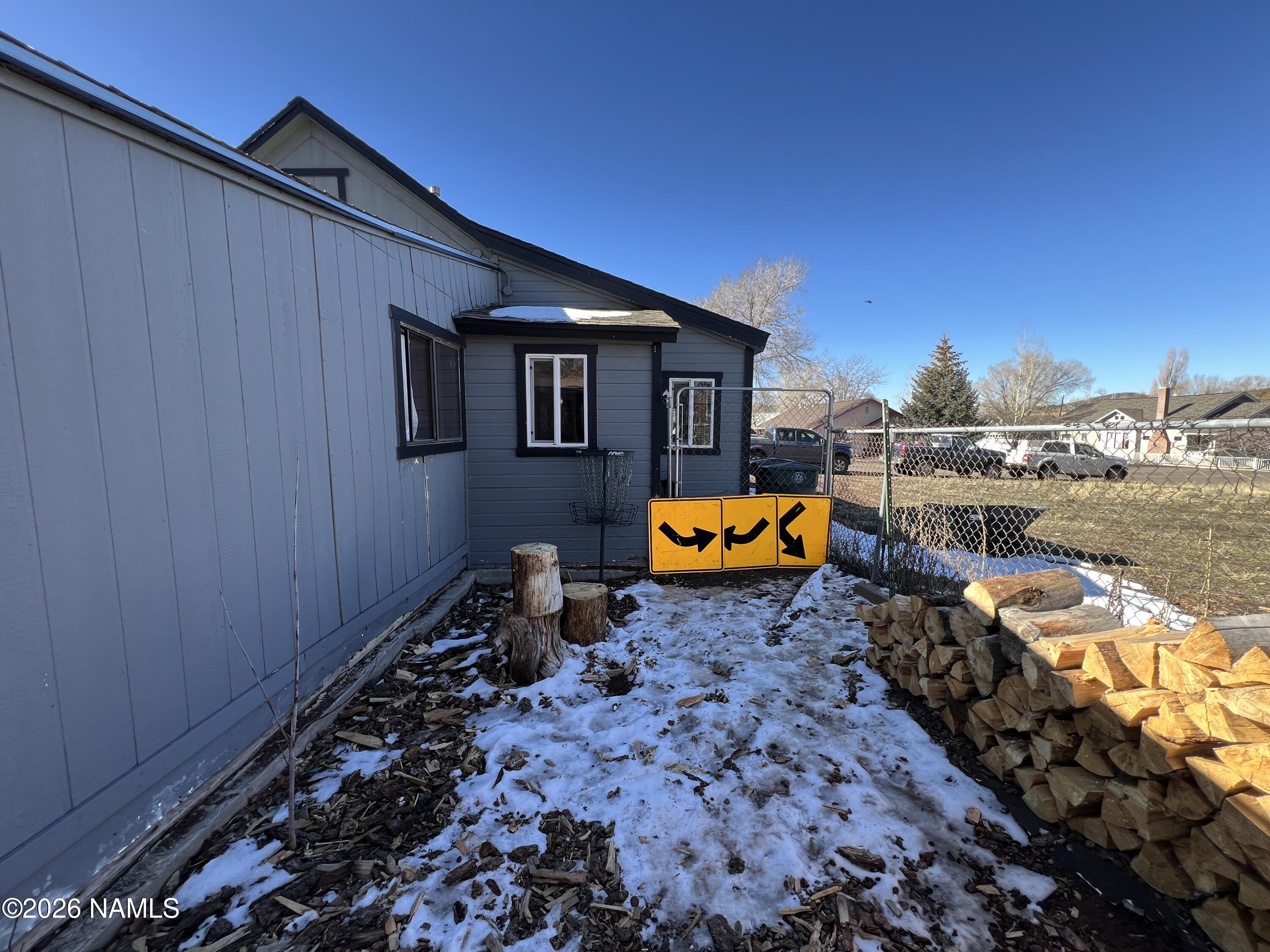 407 South 4th Street Williams, AZ 86046 - Photo 23 of 25 a backyard of a house with barbeque oven and outdoor seating
