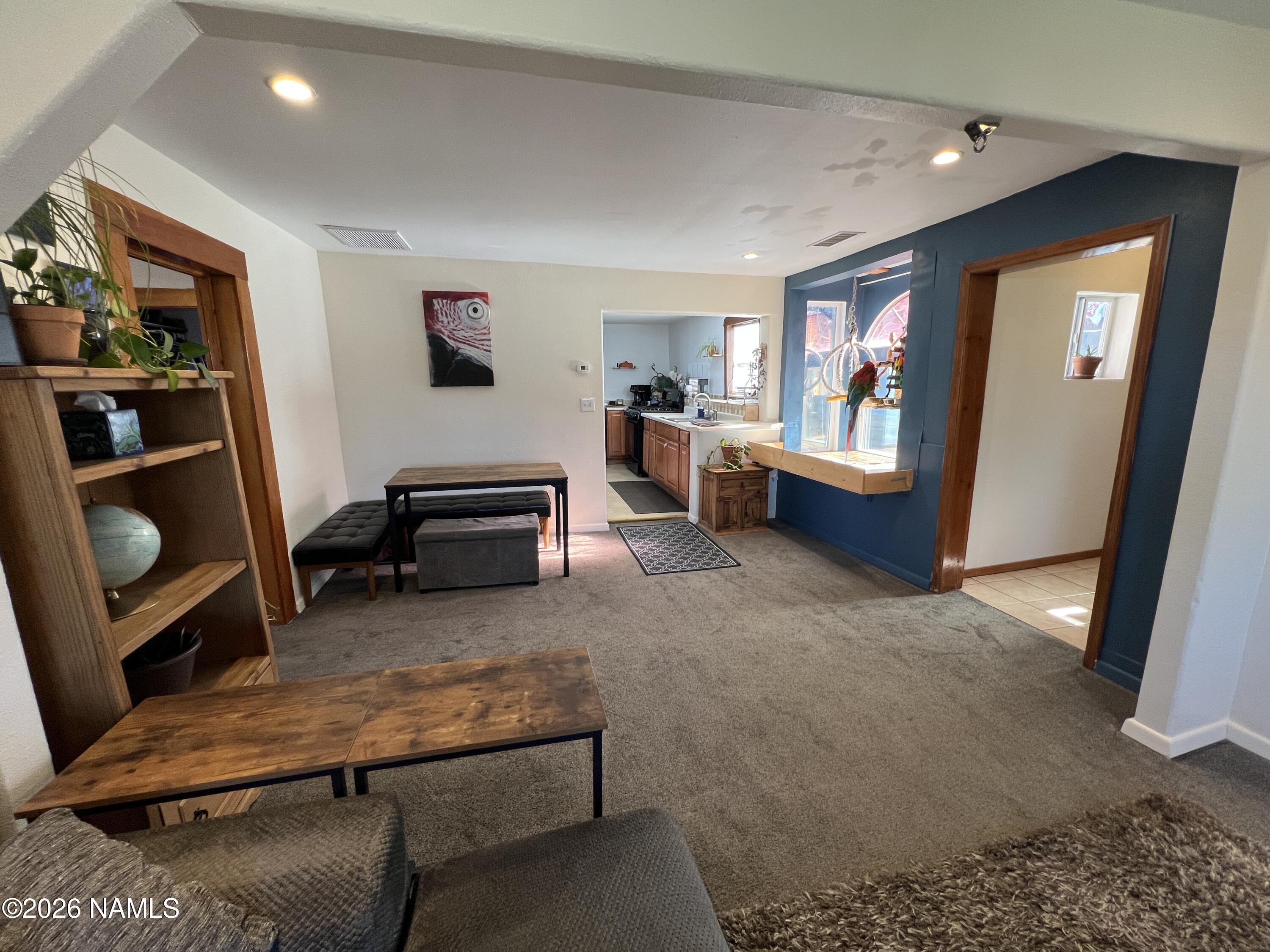 407 South 4th Street Williams, AZ 86046 - Photo 7 of 25 a living room with furniture and a window