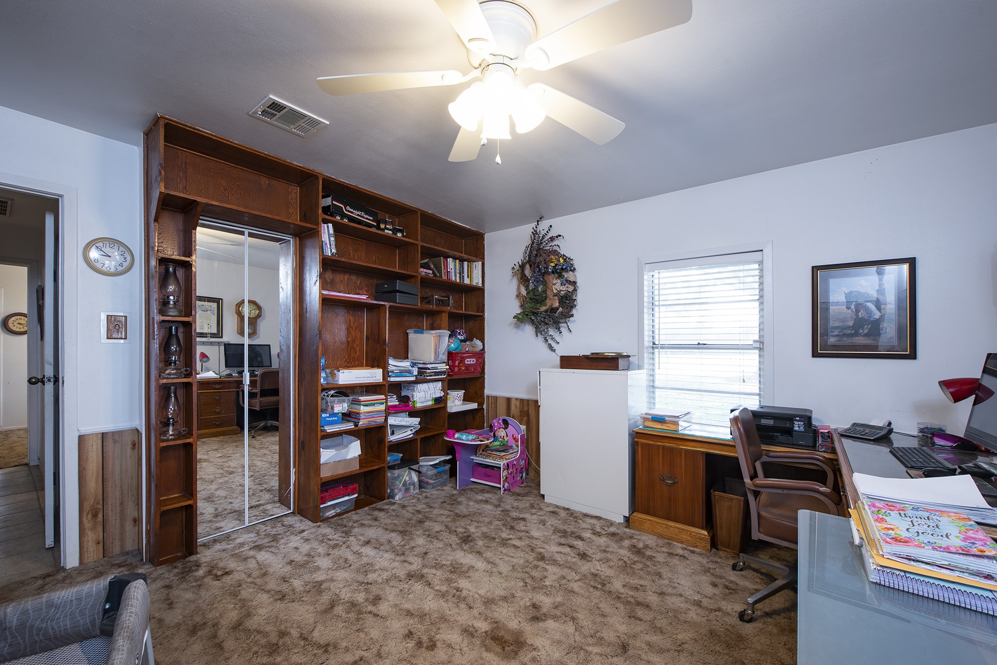 22234 Castle Road Waller, TX 77484 - Photo 35 of 50 a view of a workspace with furniture and a livingroom
