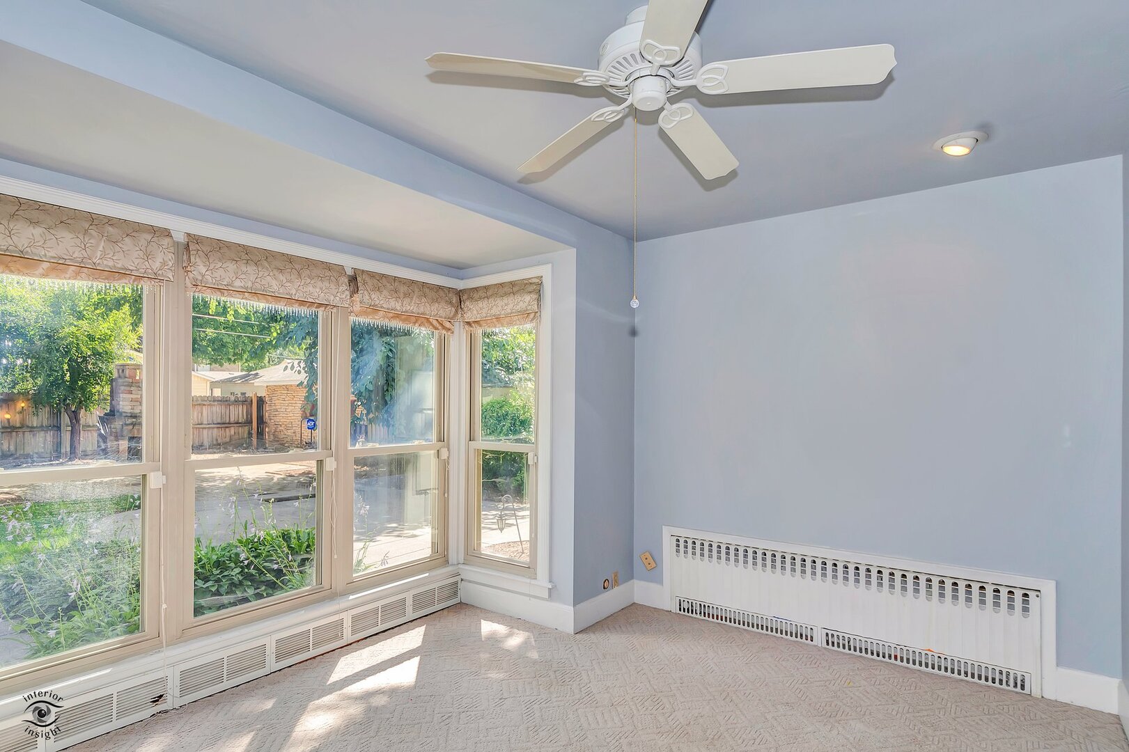 1096 South Wildwood Avenue Kankakee, IL 60901 - Photo 13 of 38 a view of a livingroom with a ceiling fan and window