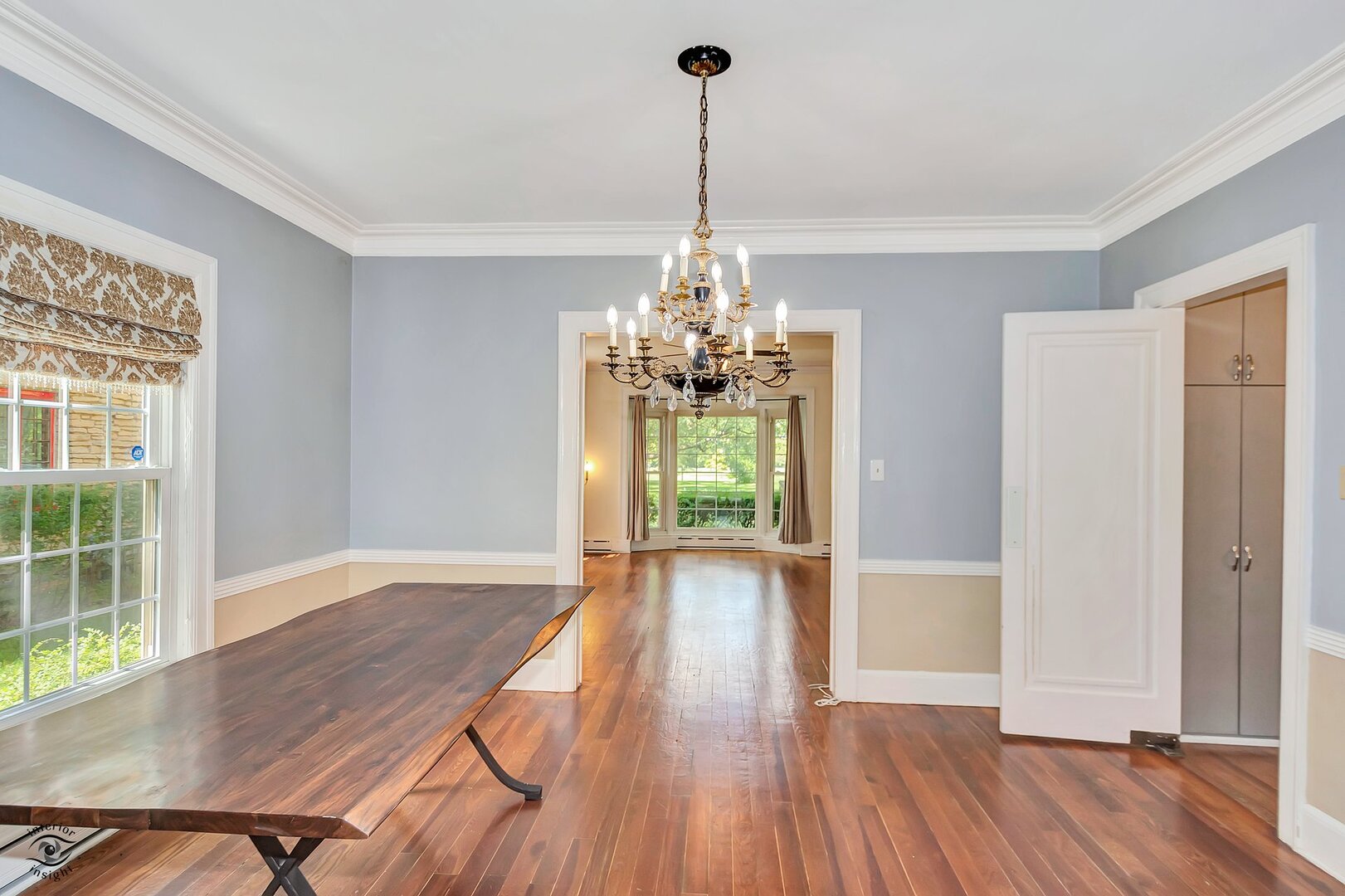 1096 South Wildwood Avenue Kankakee, IL 60901 - Photo 14 of 38 a view of a room with wooden floor chandelier and windows