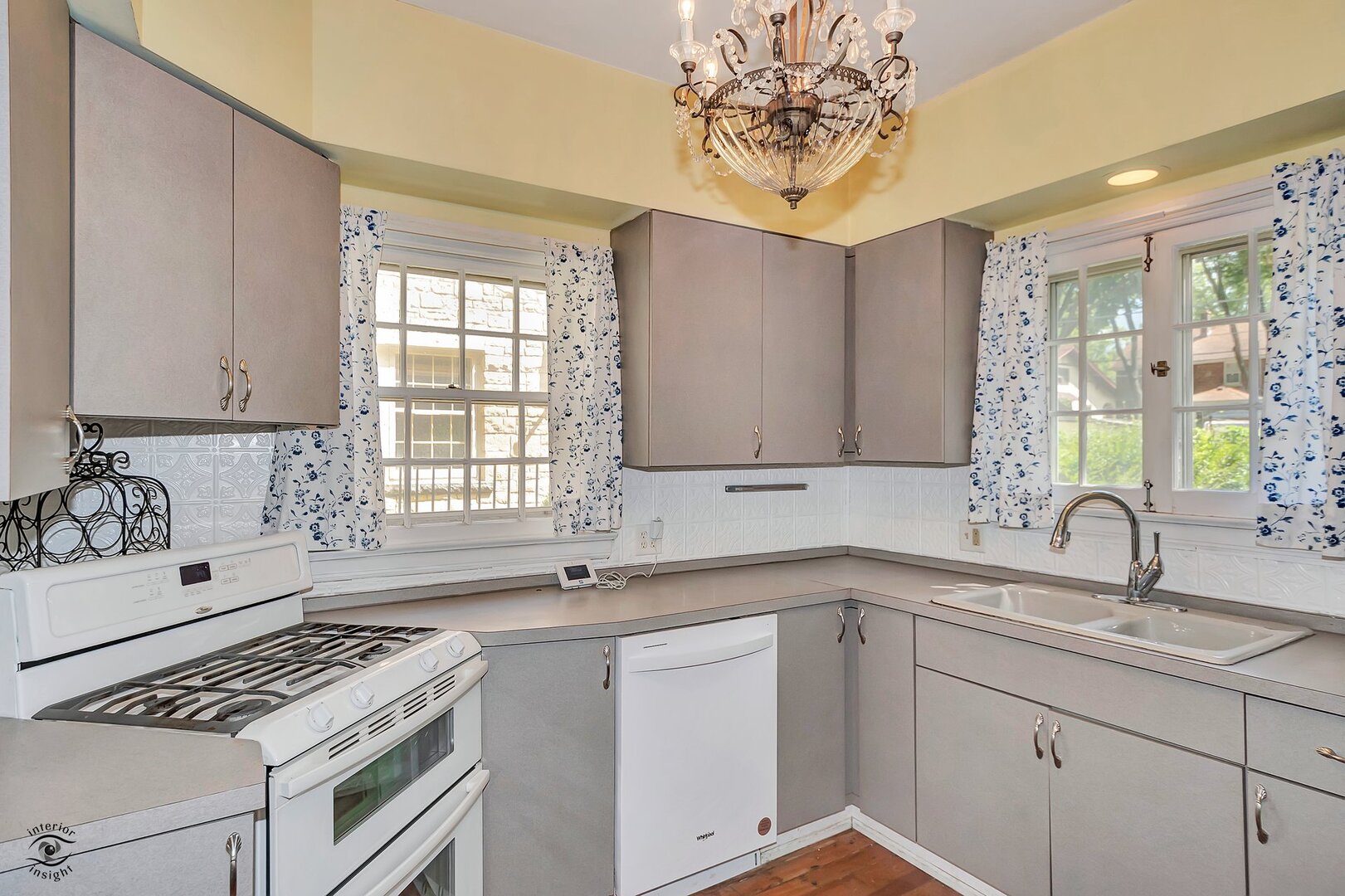 1096 South Wildwood Avenue Kankakee, IL 60901 - Photo 17 of 38 a kitchen with a sink stove and cabinets